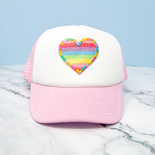 Glitter Rainbow Heart Youth Trucker Hat in Pink